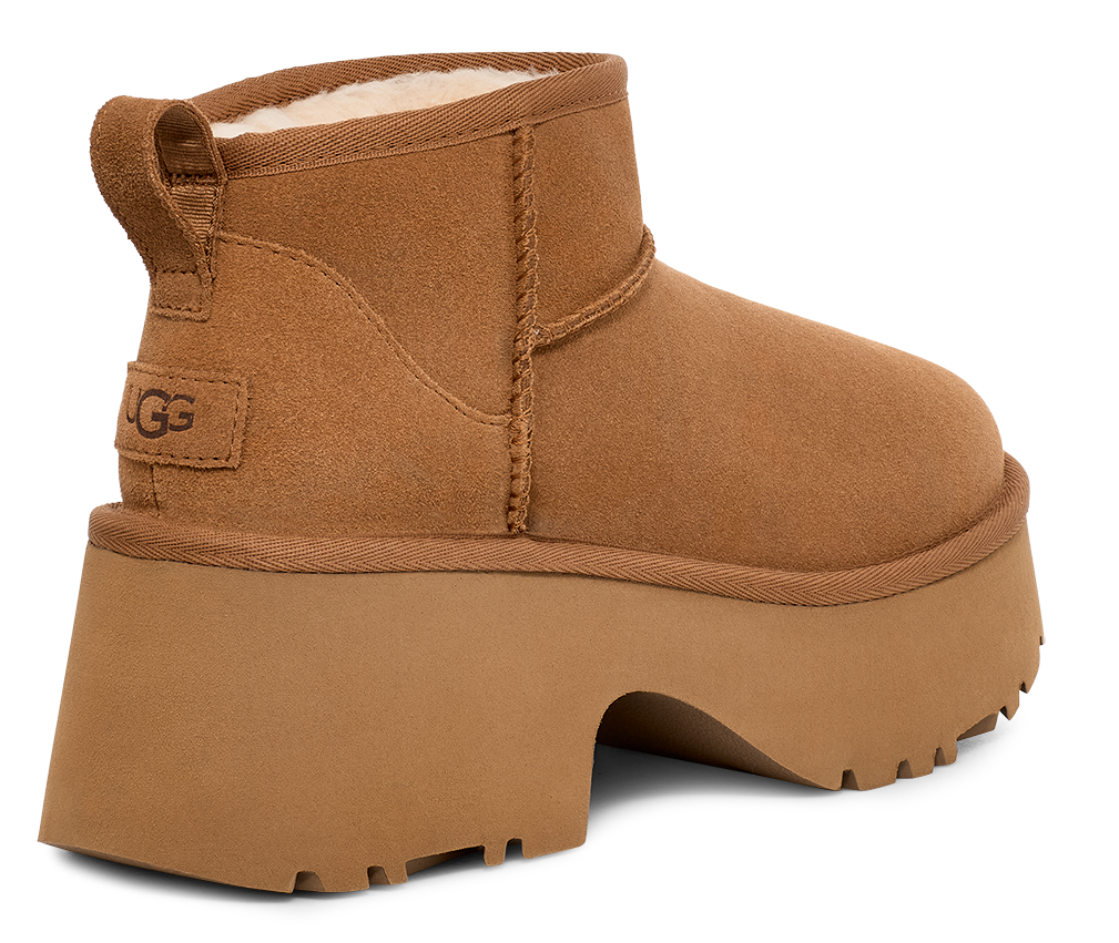 Brown UGG boot with a thick platform sole and heel.
