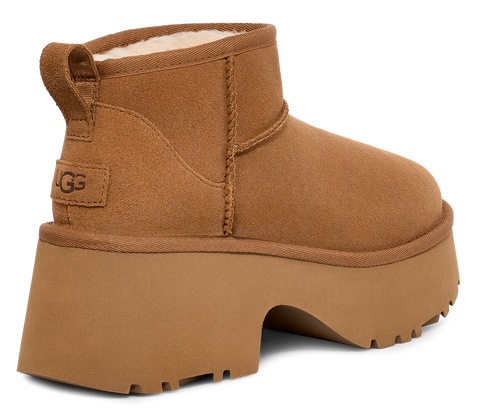 Brown UGG boot with a thick platform sole and heel.