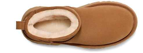 Tan-colored boot with a round toe and white fur lining.