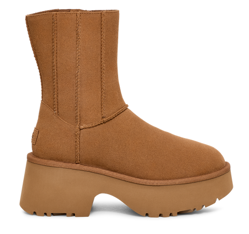 Platform light brown sheepskin boot with vertical seams.