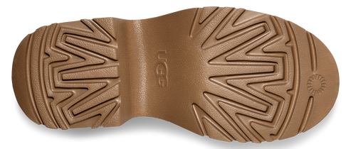 a light brown lug outsole with the letters "UGG" on the arch