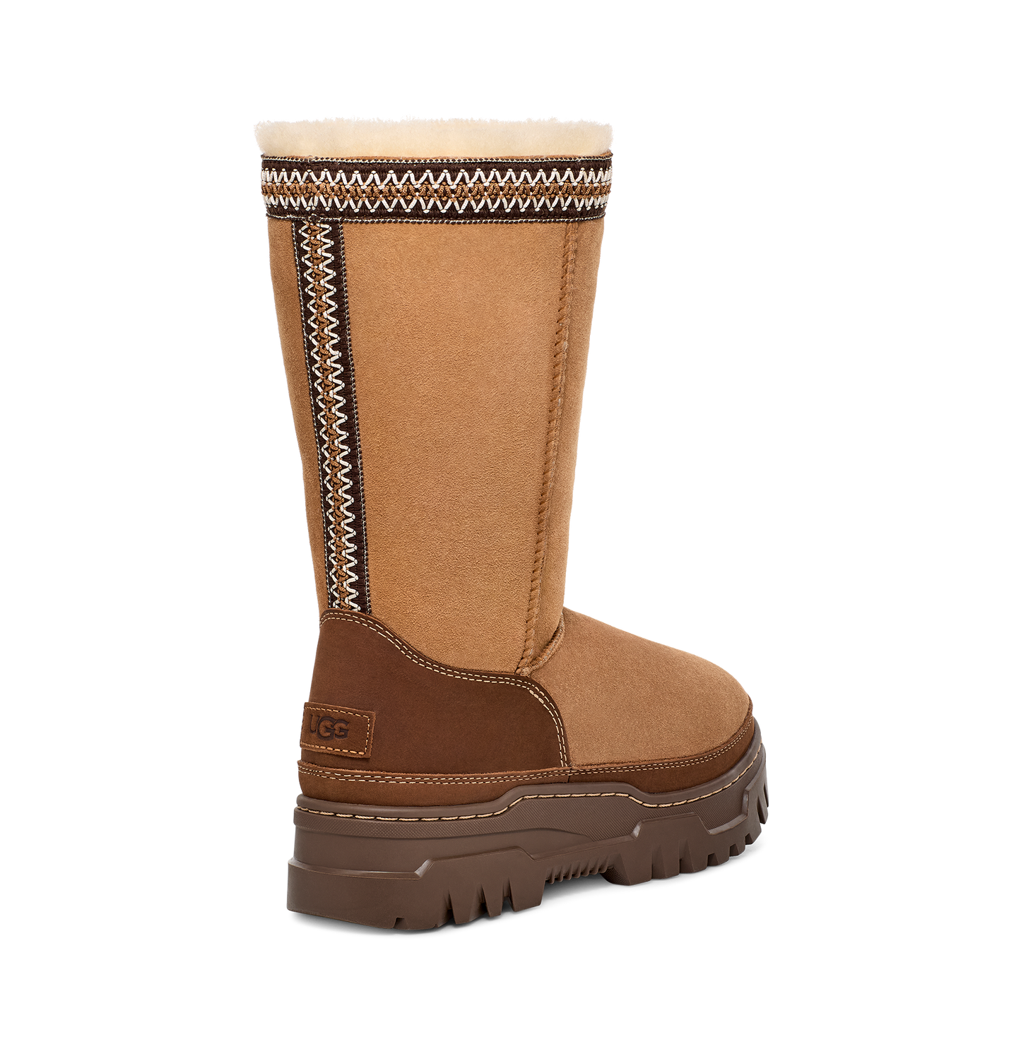 A mid-calf brown boot with a light brown and dark brown pattern around the top edge.