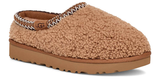 Beige slipper with patterned trim and platform sole.