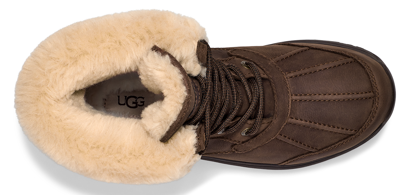 A brown boot with cream colored fur lining.