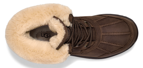 A brown boot with cream colored fur lining.