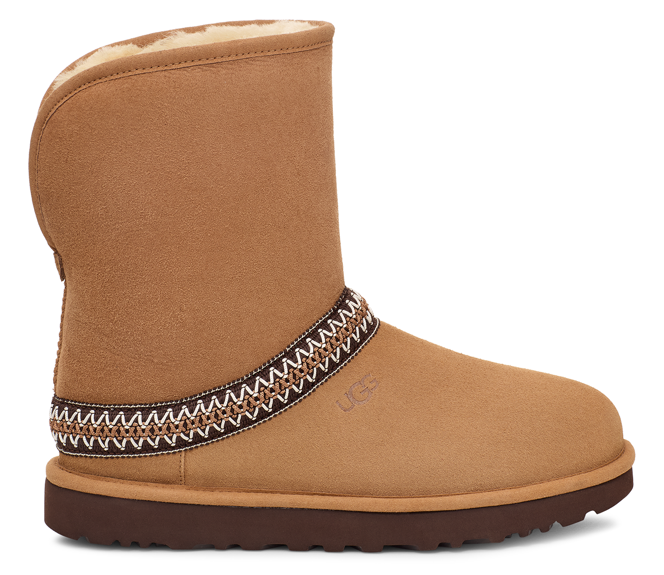 Tan suede boot with decorative trim, brown sole, and plush lining.