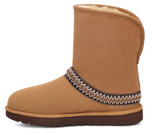 Brown suede boot with an embroidered band around the shaft.