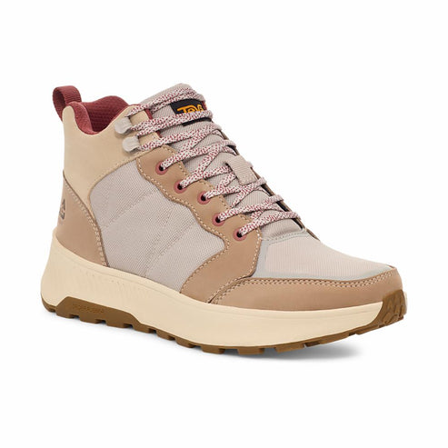 Beige hiking boot with pink speckled laces, a light beige sole and a brown outsole.