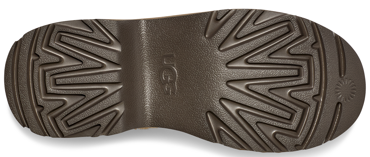 A boot sole with a zigzag pattern and the logo UGG.
