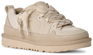 Low-top sneaker with suede trim, thick laces, and a notched beige sole.