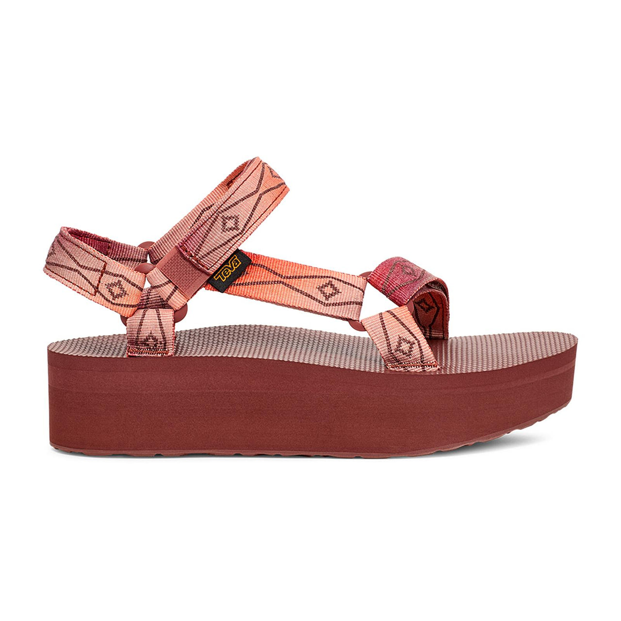 Platform sandal with patterned pink, orange, and beige straps.