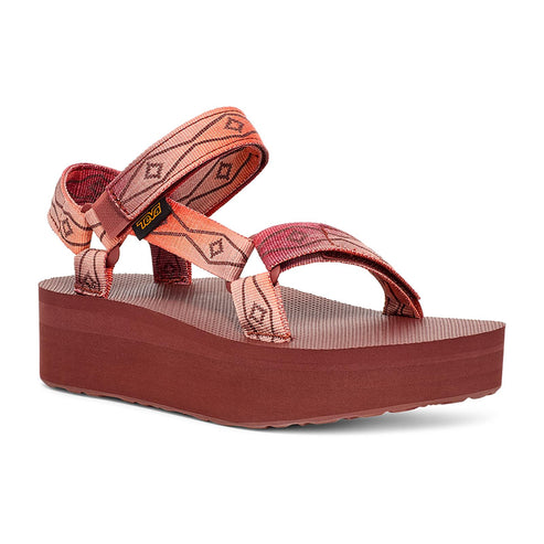 Platform sandal with patterned straps in shades of coral.