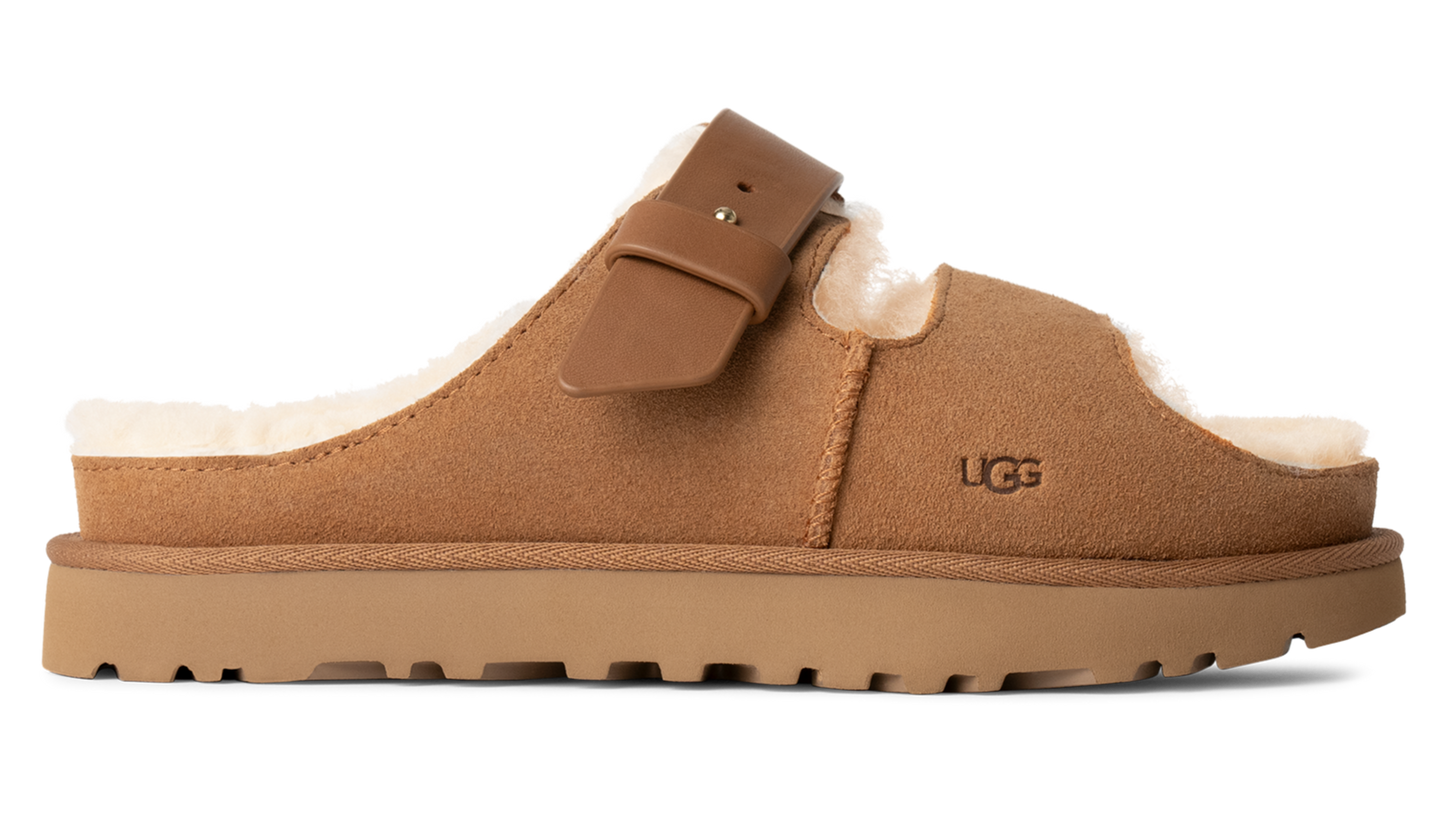 Tan mule slipper with buckle and lug sole.