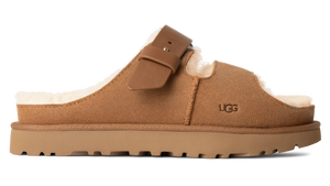 Tan mule slipper with buckle and lug sole.