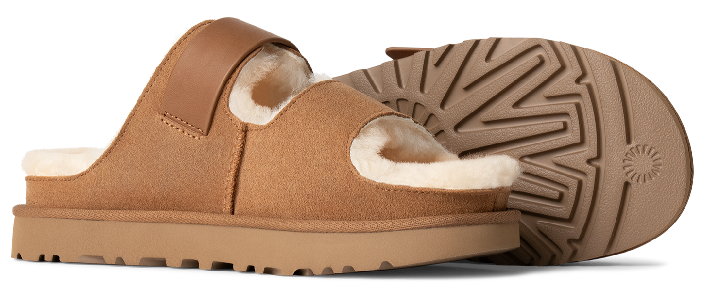 Two tan slide slippers, one showing the sole, with shearling lining.