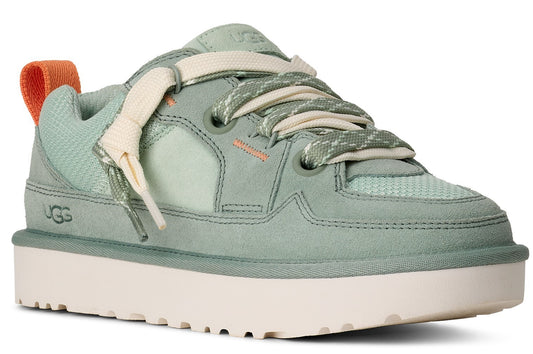 Ugg light green suede and mesh sneaker with white platform sole and thick white laces, and an orange heel tab.