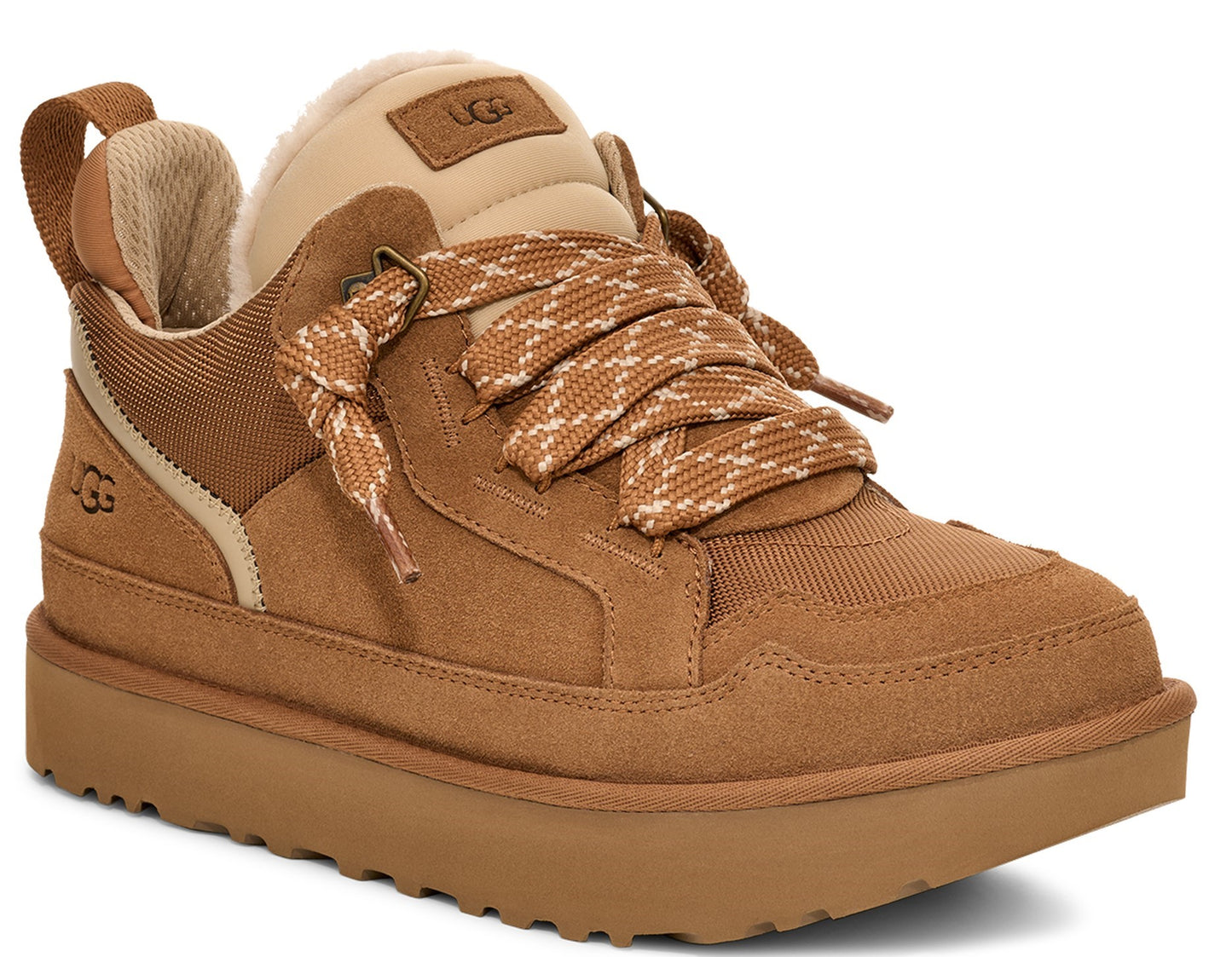 Tan sneaker with patterned laces, light beige collar and loop at back.