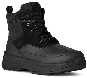 A black hiking boot with a thick treaded sole, suede panels, and a lace-up closure.