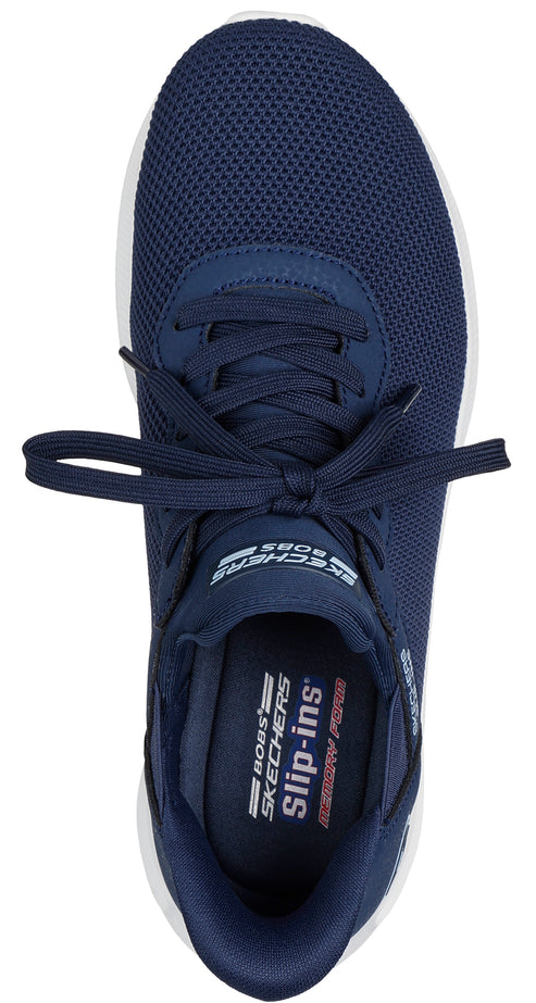 Top-down view of a navy blue slip-on sneaker with mesh upper, white sole, and 'slip-ins' and 'MEMORY FOAM' printed on the insole.