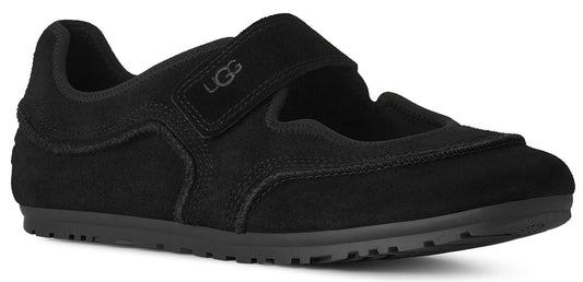 A black suede Mary Jane style flat shoe with a hook and loop strap featuring the UGG logo embossed on the strap and a textured rubber sole.