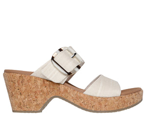 White canvas platform sandal with a decorative buckle strap.