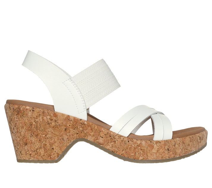 White wedge sandal with cork platform and heel.