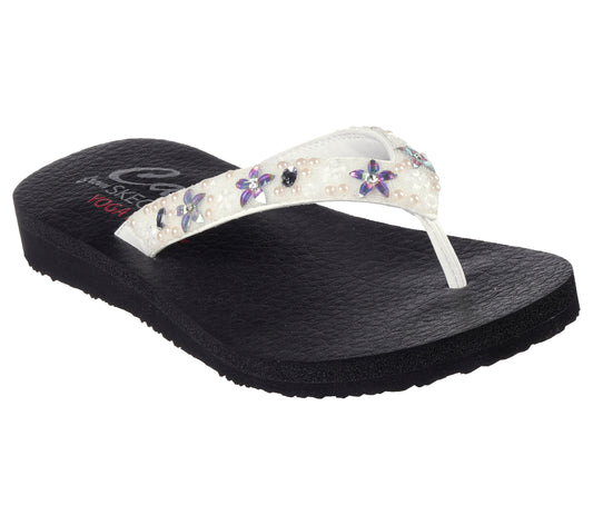 Black sandal with a white strap, adorned with faux pearls and floral gems.