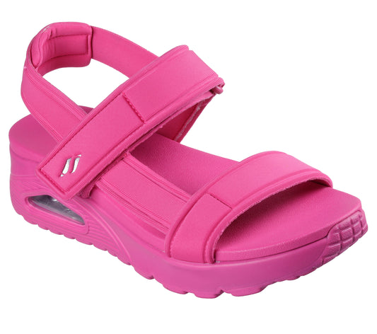 Pink sandal with two hook-and-loop adjustable straps and a visible air cushion heel.