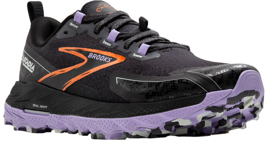 Trail running shoe in black with a jagged purple outsole, orange logo and laces with purple hardware.