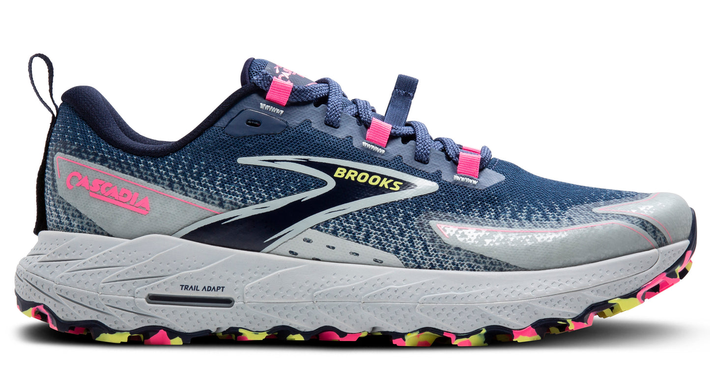A blue running shoe with pink accents and 'TRAIL ADAPT' text on the sole.