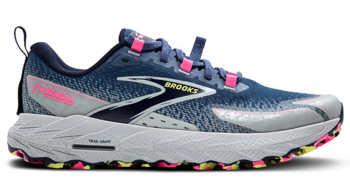 A blue running shoe with pink accents and 'TRAIL ADAPT' text on the sole.