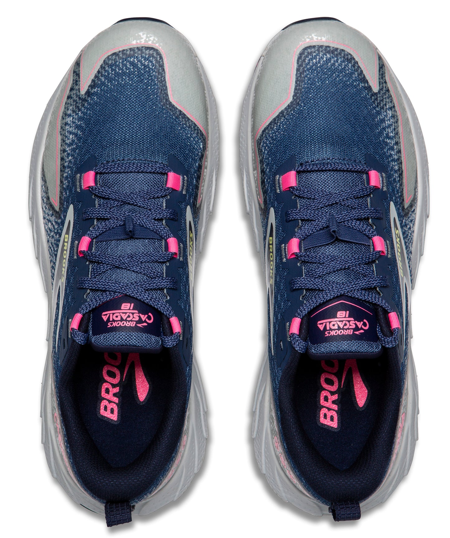 Overhead view of navy athletic shoes with pink details and laces.