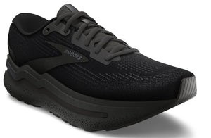 Black running shoe with a thick textured sole and laces. The word BROOKS is visible on the side.