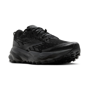 Black trail running shoe with a lugged outsole.