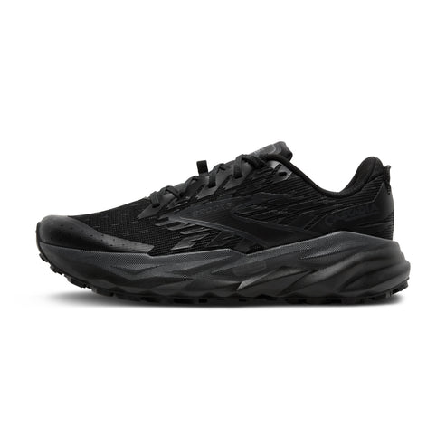 All black running shoe with jagged sole.