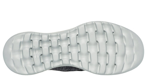 Bottom view of a gray athletic shoe with a white treaded sole.