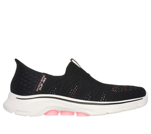 Black slip-on shoe with white sole and pink accents.
