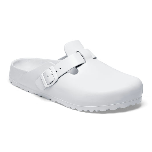 White clog shoe with a buckle.