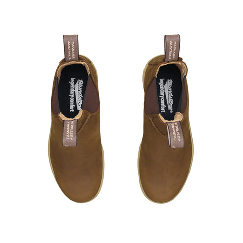 Two brown pull-on boots with elastic side panels. The lining is brown with "Blundstone legendary comfort TASMANIA AUSTRALIA" printed inside.