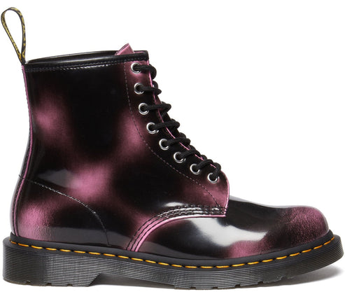 High-top boot, black with pink blotches, and black laces.
