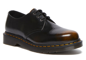 Leather upper dress shoe with black laces and a rubber sole.