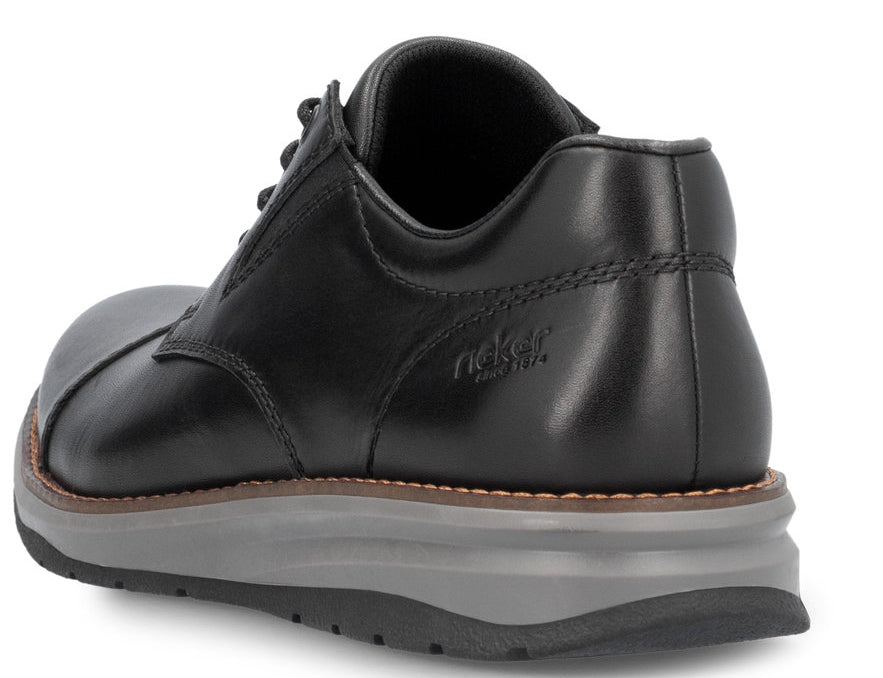 Black leather shoe with gray sole, lace up, logo on heel.