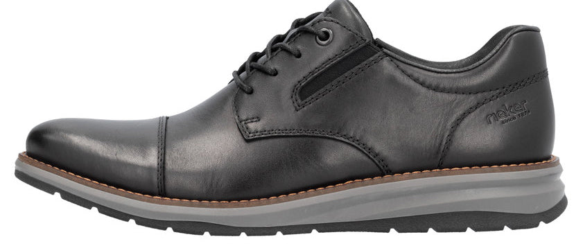 A black leather dress shoe with a rounded toe, lace-up closure, and light gray sole.