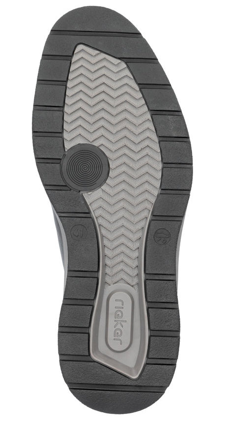 Sole of a shoe with rieker label and patterned grip.