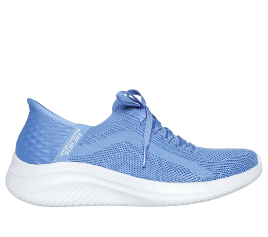 Light blue sneaker with white sole and the text "SKECHERS SLIP-INS" on the side.