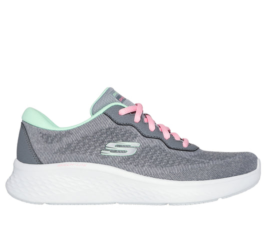 A gray sneaker with white sole and pink laces.