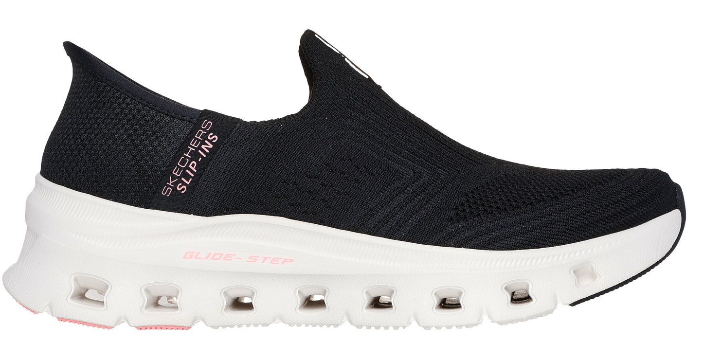 A black slip-on shoe with a white sole.