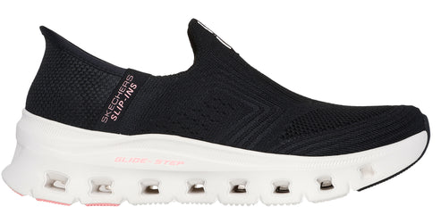 A black slip-on shoe with a white sole.