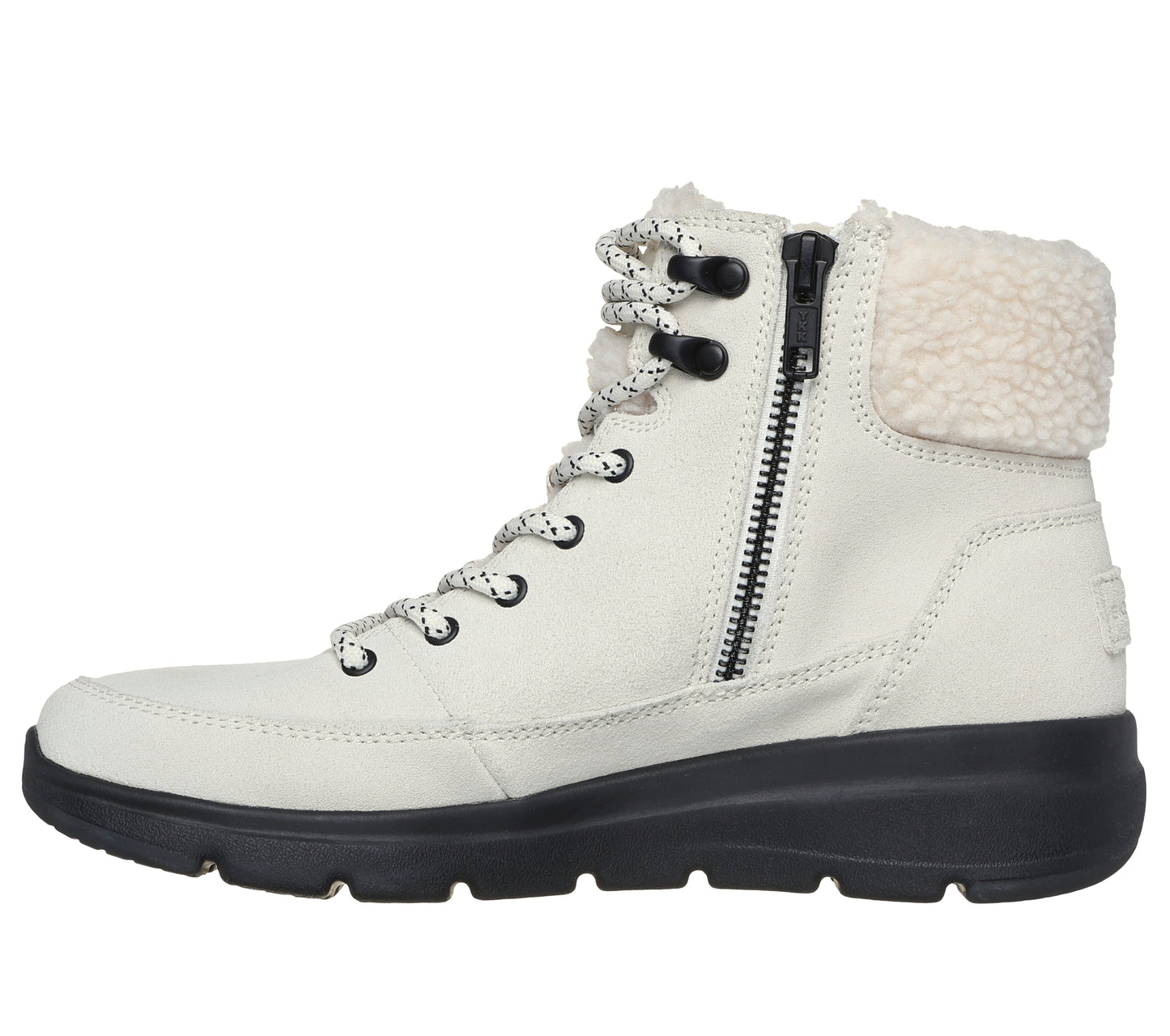 A white ankle boot with a black sole features black eyelets, a white and black shoe lace, a zipper, and a cream-colored shearling lining.