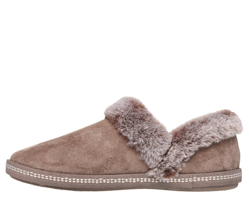 A brown slip-on slipper with faux fur trim.